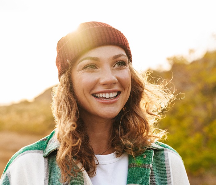 Smiling, happy woman enjoying time outdoors