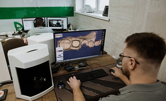 Dental team member using CAD/CAM technology