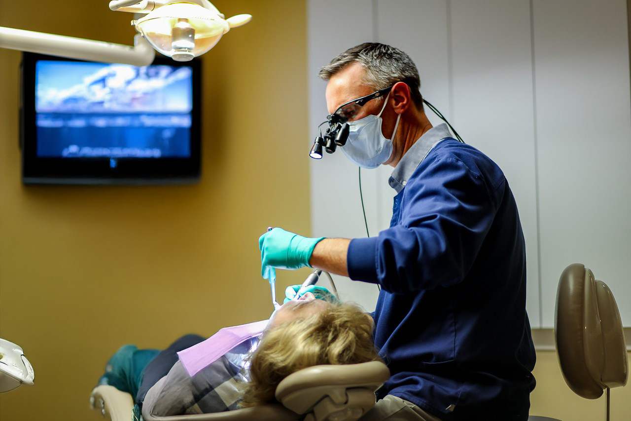 Dental team member treating dentistry patient