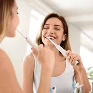 Woman brushing her teeth